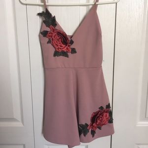 Mauve pink romper with floral accents